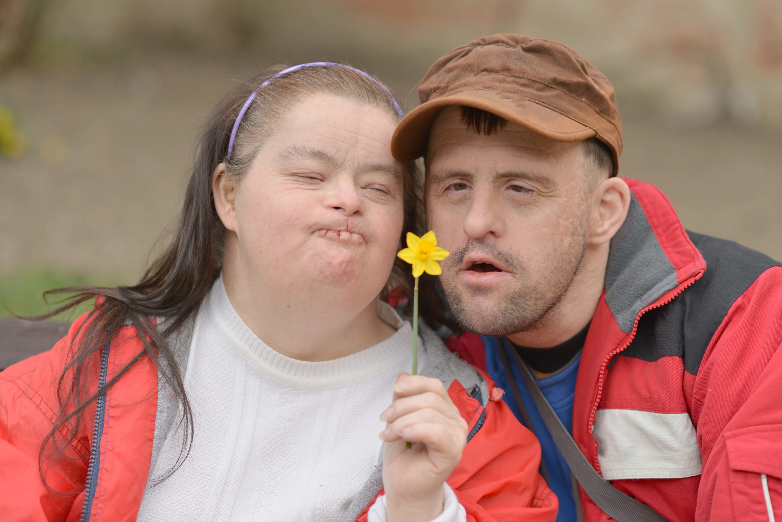 Individuals with special needs supported within their community, showing dignity and confidence
