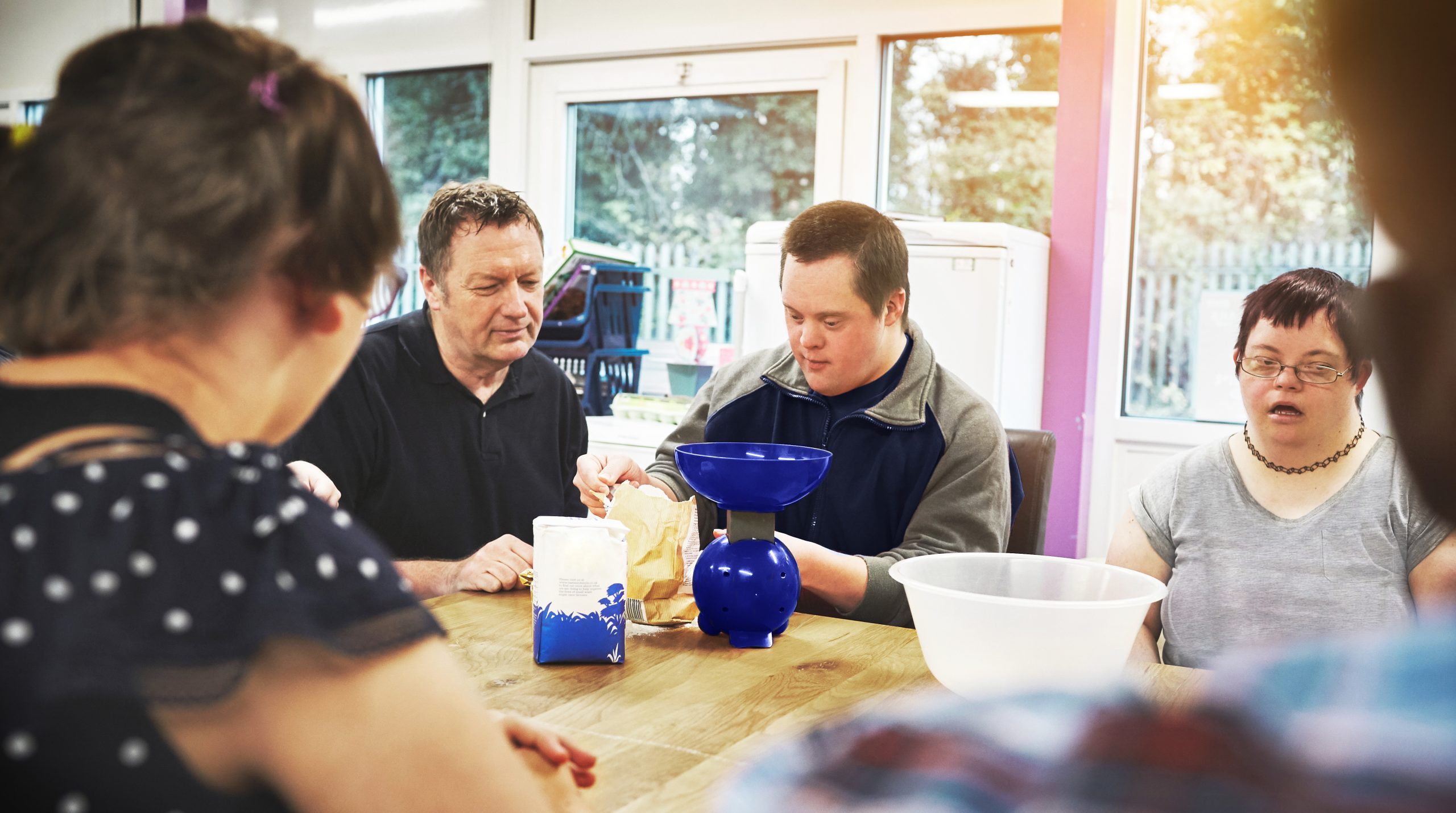 Child with autism smiling confidently in an inclusive space